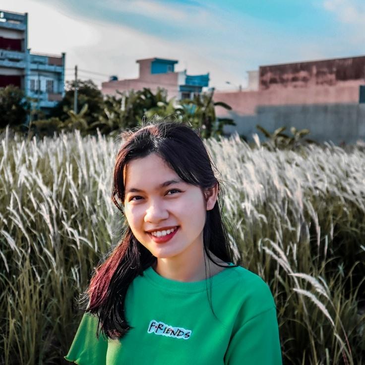 Kaveri Mehta, Lead Design Curator at VerdantBrookViolet, reviewing corporate floral arrangements